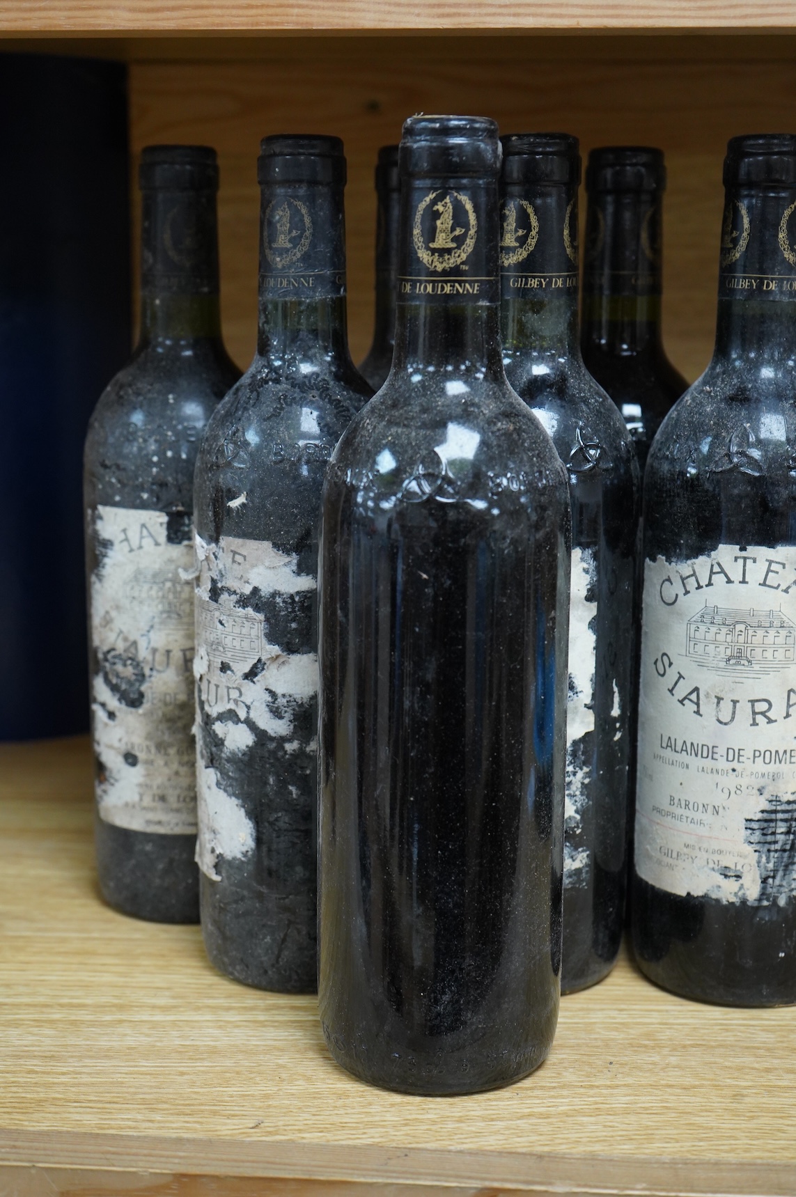 Eight bottles of Chateau Siaurac 1982, labels defective